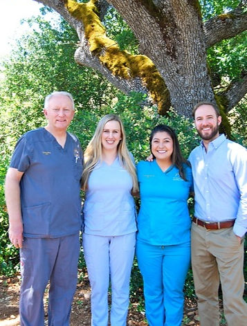 The Yosemite Dental Care team outside the Mariposa office, standing under a California oak.